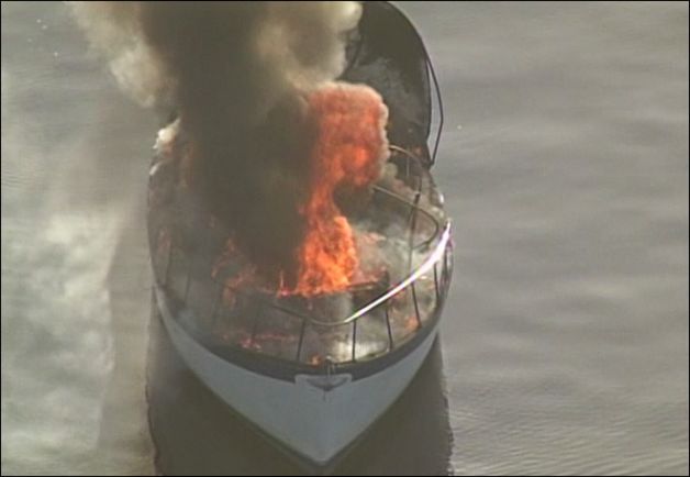 5-11-2012 PHOTO Man rescued from burning boat in agate pass.jpg